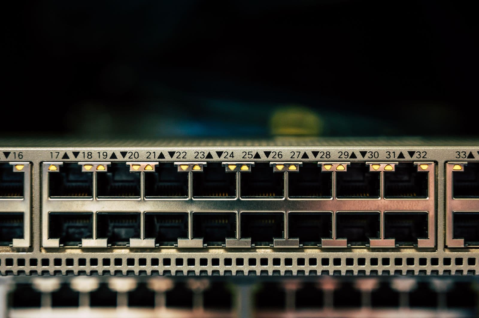 Close-up of a network switch with connected Ethernet ports